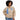 Black woman wearing a lightweight snap-front windbreaker jacket with embroidered lettering and shield logo on the chest.